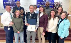 Bill Receski receives the Golden Anchor award Monday, Feb. 10 from the Kent County Board of Education. From left are, Director of Human Resources Dan Hushion, student Board member Alden Swanson, Board members Frank Rhodes and Aretha Dorsey, Receski, Board