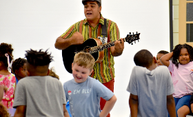 Students dance as Chestertown artist Fredy Granillo plays the Cuban folk song "Guantanamera" during a Hispanic Heritage Month presentation at H.H. Garnet Elementary School Thursday, Sept. 21.