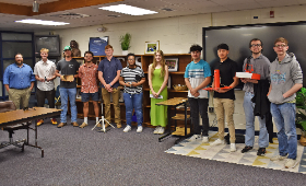 Kent County High School engineering teacher Brett King, left, joins his senior Project Lead the Way students Monday, May 8 for a photo after they showed the Board of Education what they've been working on in the program.