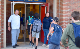 Teachers John Keller and Cheryl Bachmann greet Kent County High School ninth-graders as they enter the building Tuesday morning, Sept. 5. 