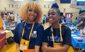 Kent County High School students Cherish Johnson, left, and Tatiana Thomas volunteer at the Maryland Business Roundtable for Education's College and Career Fair Thursday, April 20.