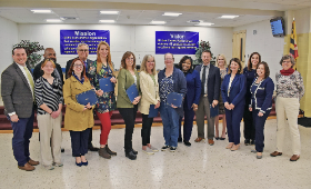 From left are Dan Hushion, Alden Swanson, John Queen, Kaitlyn Wright, Frank Rhodes, Anna Lill, Stephanie Spencer, Lori Armstrong, Noel Morris, Aretha Dorsey, William Poore, Kris Hemstetter, Gina Jachimowicz, Laura McKenzie, Dr. Mary Boswell-McComas and Tr
