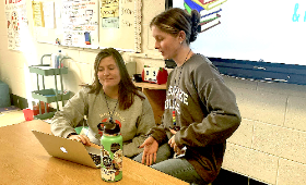 Teacher Kimberly Isaacson, left, chats with student support coach Brynne Jachimowicz at Rock Hall Elementary School. Student support coaches are paired with teachers to help meet students' needs.
