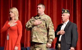 From left, Principal Kris Hemstetter, Capt. Brian Wharton and retired Col. Joe Sanders recite the Pledge of Allegiance Friday, Nov. 11 during a Veterans Day assembly at Kent County High School. Wharton and Sanders spoke to students about the importance of