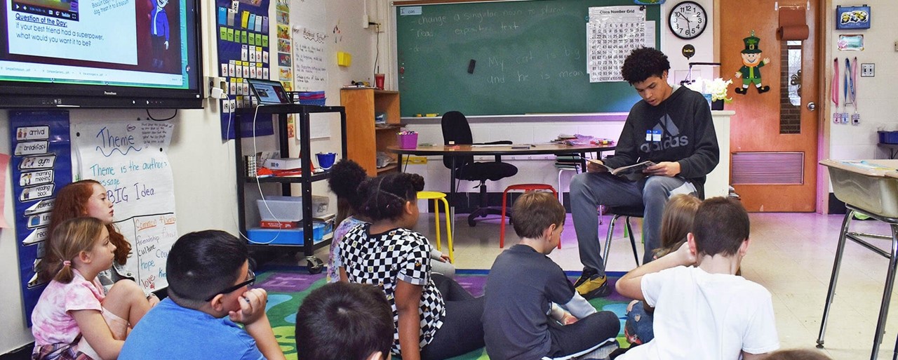 KCHS student Larry Steward reads to Rock Hall students